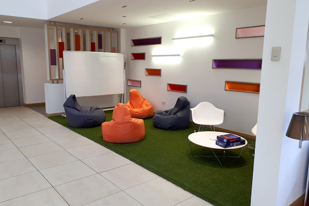 artificial grass used in a commercial workspace for an employees rest area